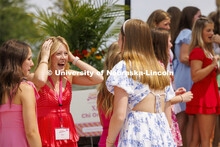 Sorority compare experiences while waiting outside the Chi Omega sorority during Wednesday’s Phila
