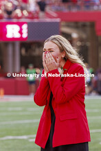 Homecoming royalty Emmerson Putnam, biological sciences major of Bellevue, Nebraska reacts after bei