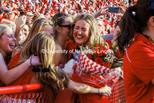 Homecoming royalty Emmerson Putnam receives a hug at the Nebraska vs Rutgers football game. Homecomi