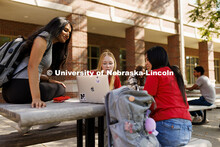 Students studying outside the Raikes Center. Raikes School photoshoot. October 9, 2024. 