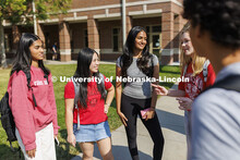 Students socializing outside the Raikes Center. Raikes School photoshoot. October 9, 2024. 