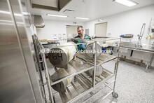 Jeffrey Price, Associate Director, Nebraska Gnotobiotic Mouse Program, uses an autoclave to steriliz