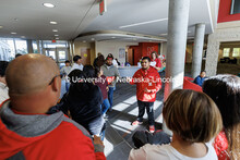 NSE student ambassador Jhovany Millan speaks with families as they take a campus tour during Spanish