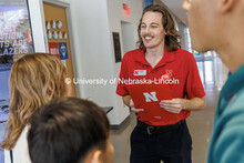 NSE student ambassador Michael Allen speaks with families during Spanish Visit Day. October 26, 2024