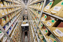 Several stories above the ground, Josh Caster, Archives Manager for University Libraries, retrieves 