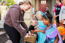 Lyndee Friedrich from the sorority Chi Omega, hands out candy to little kids. The University hosted 