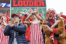 Denis Mcginty, right, throws the bones and gets loud with students during a third down. Nebraska vs 