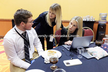 Dane Lyons, from left, Sophie Farrell, and Olivia Reed talk to each other as they send in video from