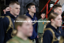 NROTC Staff Sergeant Dylon Taylor directs midshipmen into Memorial Stadium. Navy and Marine Corps 24