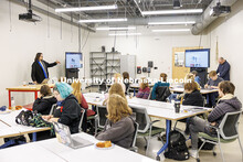 Architecture alum Gordon Stotz, left, speaks with students inside the Johnny Carson Center for Emerg