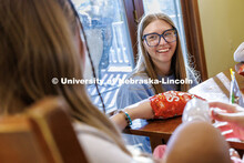 Lighthouse's volunteer and community outreach coordinator and UNL alumna, speaks with students insid