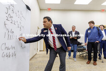 Robin Garewal, Assistant Professor of Practice in Marketing, tallies the judges votes to decide a wi