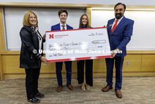 Kylie Eads and Aidan Kelch, center, stand with their first-place check. Fall 2024 Center for Sales R