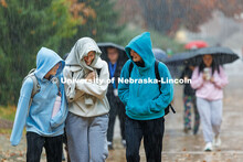 Madison McLaughlin, from left, Kara Liebentritt, and Olivia O’Connelle laugh as they rush to Love 