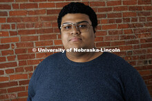 Studio portrait of Tavion Davis, Digital Content Sepcialist, University Communication and Marketing.