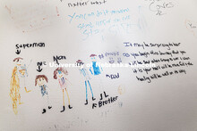 Inspirational messages and drawings cover the walls of a stairwell inside BraveBe Child Advocacy Cen