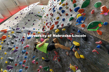 Aaron Sanchez, junior, goes parallel with the wall as he works to climb up in the Campus Recreation 