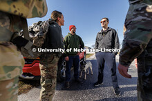 UNL Student Veterans of America treasurer Brett Klein (right) thanks the four volunteers after arriv