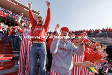 Tom Dey, right, cheers alongside other Nebraska fans after a big opening kickoff return. Nebraska vs