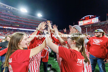 Husker fans storm the field following the team’s 44-25 win over Wisconsin to secure bowl game elig