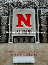 Alumni Center plaque is dusted with snow. Snow on City Campus. January 8, 2024. Taylor DeMaro / Univ