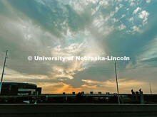 Looking west toward the Lincoln Haymarket. A cloudy sunset over the bridge near Pinnacle Bank Arena.