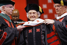 Marion (Patton) Larmon receives her honorary Doctor of Fine Arts hood from Dr. Jeffery Gold, left, p