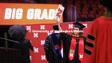 Marina Marly Dalla Betta waves to her family and friends after receiving her degree. Graduate Commen