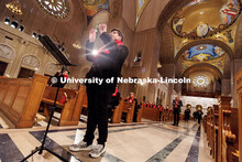 Don Torbett conducts members of the UNL Choir inside the Basilica of the National Shrine of the Imma