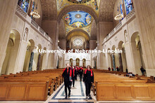 Members of the UNL Choir walk inside the Basilica of the National Shrine of the Immaculate Conceptio