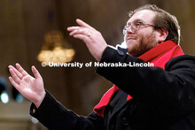 Adam Lange conducts members of the UNL Choir inside the Basilica of the National Shrine of the Immac