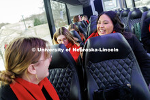 Sofia Dominguez, right, records Rose McClelland while sitting on the bus. Inauguration choir trip. J