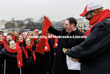 Chancellor Rodney Bennett surprises U.S. Congressman Mike Flood with a scarf as he met with members 