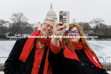 UNL's Peter Eklund and Marci DeAmbrose pose for a selfie in front of the United States Capitol. Inau