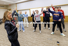 Julie Uribe, Lecturer in the College of Business, guides students through various warm-up activities