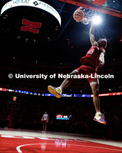 Nebraska football wide receiver Quinn Clark dunks the ball during the football team’s dunk contest