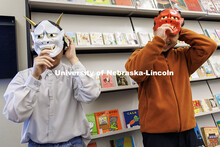 Jerry Zhu, left, junior Secondary Education major, and Hokuto Okabe put on their demon masks during 