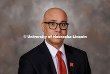 Studio portrait of T.J. McDowell, Assistant Vice Chancellor and Dean of Students in Student Life. Fe