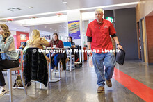Cory Densberger, a Hospitality Service Associate, walks through the Nebraska Union collecting food t