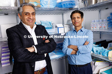 Amit Saini (left) and Alok Kumar, professors of marketing in the College of Business, stand in a med