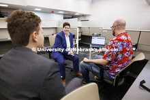 Lecturer Sydney Hayes talks with law students in the First Amendment Clinic. College of Law Clinics.