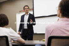 Lecturer Daniel Gutman talks with law students in the First Amendment Clinic. College of Law Clinics