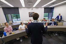 Lecturer Daniel Gutman talks with law students in the First Amendment Clinic. College of Law Clinics