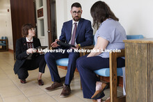 Lecturer Rachel Tomlinson Dick, left, listens as law students in the Housing Justice Clinic met with