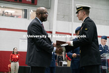 Midshipmen Lincoln Kohler receives the Chancellor's Academic Excellence Award. Joint Service Chancel