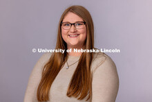 Studio portrait of Alex Dudley, Pre-Professional Coordinator for the Explore Center. May 1, 2025. 
