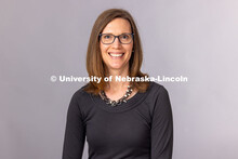 Studio headshot of Jaci Gustafson, Training and Professional Development Specialist for the Explore 
