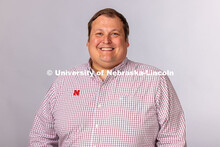 Studio portrait of Joey Lynch, Director of University Advising for the Explore Center. May 1, 2025. 