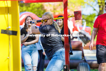 Sophomore, Claire Gangwish, prepares to hit the High striker’s bell will a hammer during the End o