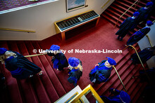 Graduates climb the stairs into the Lied Center prior to the graduation ceremony. 2025 College of La